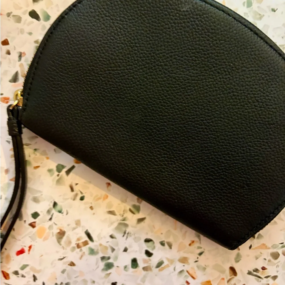 Brand new kate spade black pebble leather wristlet clutch with gold logo